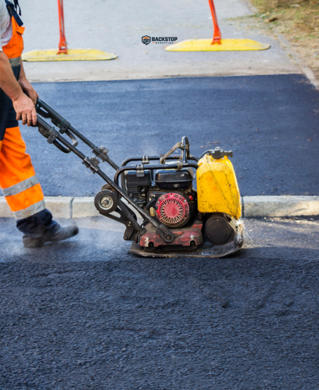Crew on a paver patio, phone ringing unanswered